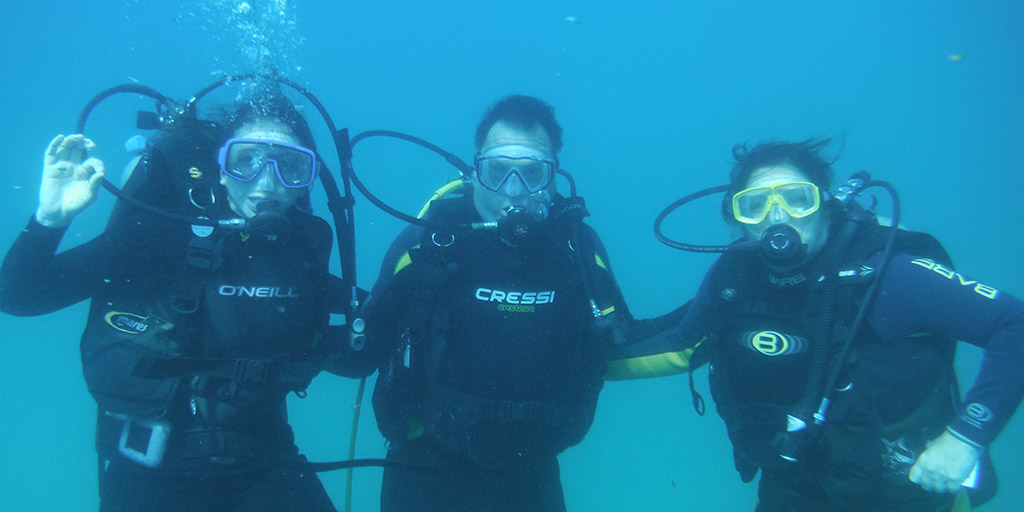 Dr. Hugh Riley and friends scuba diving