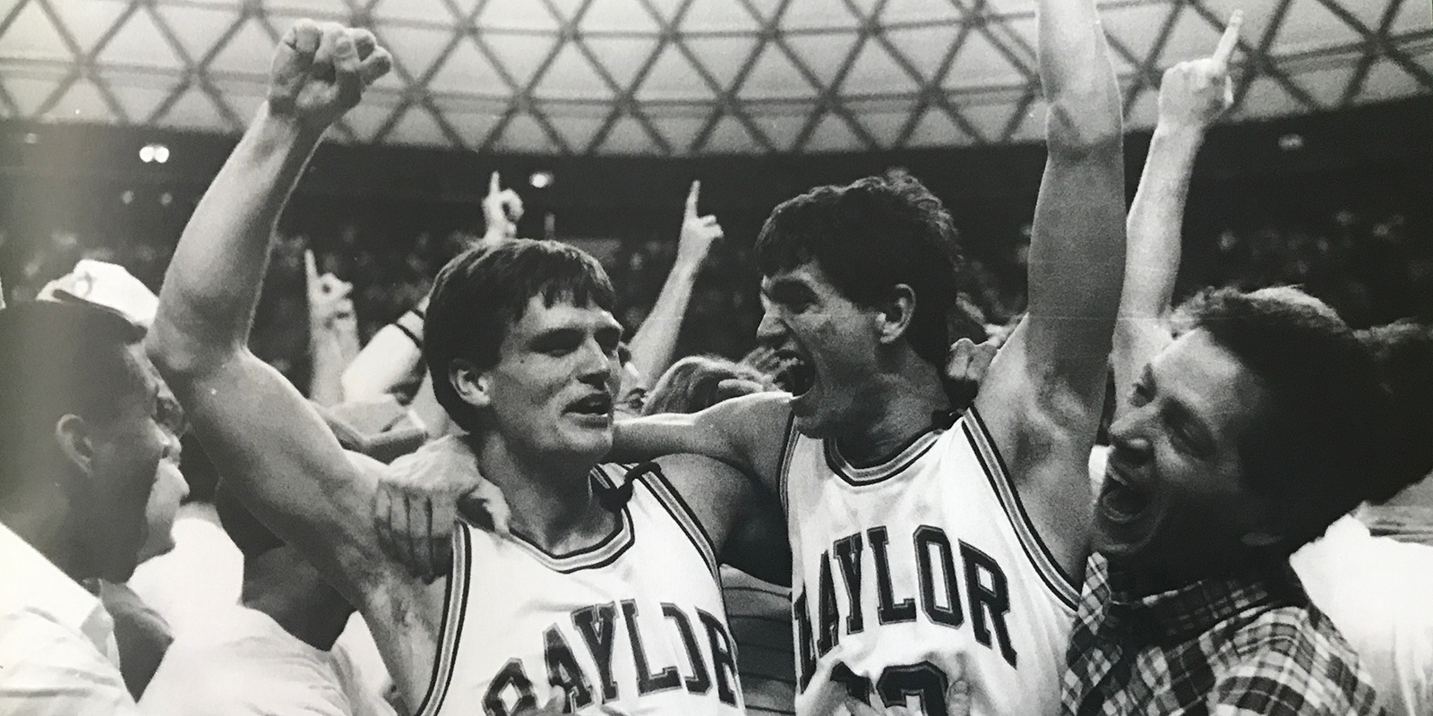 Baylor men celebrate a win over Arkansas, 1990