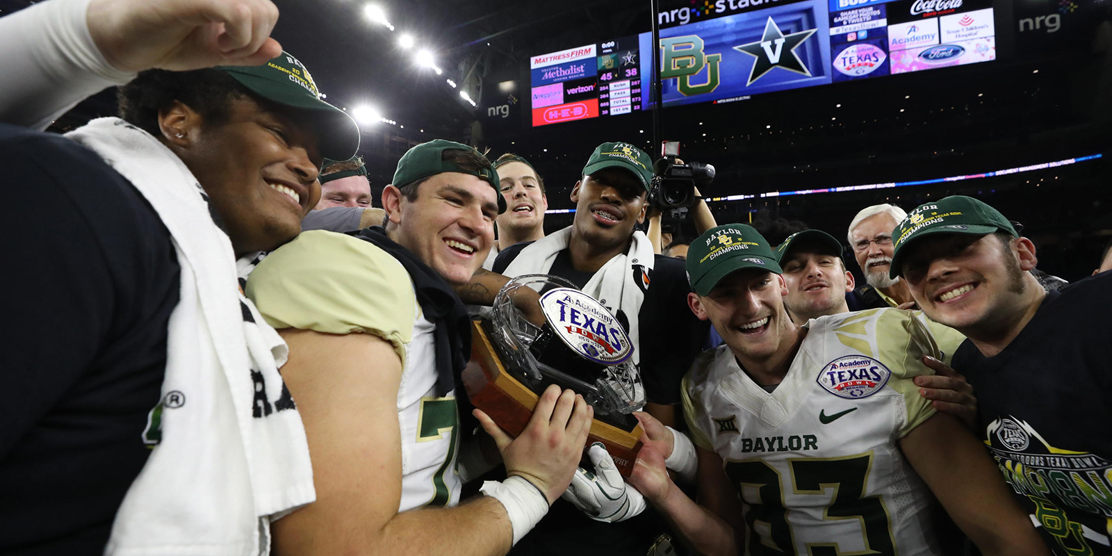 Baylor football players with Texas Bowl trophy