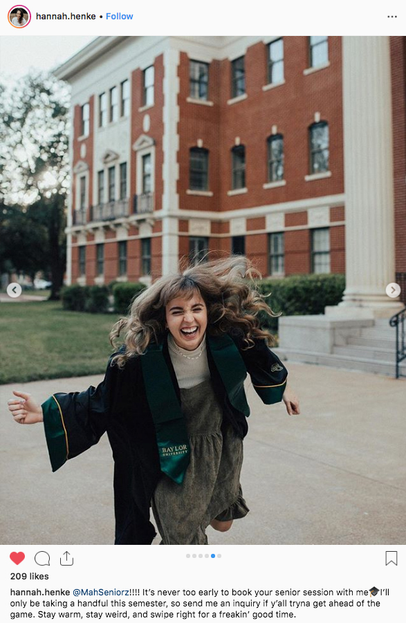 A female Baylor graduate laughing outside Pat Neff Hall