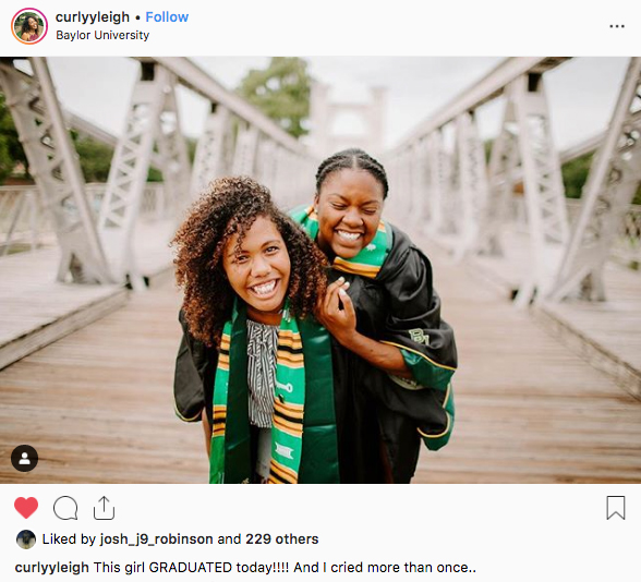 Two female Baylor graduates on Waco's Suspension Bridge