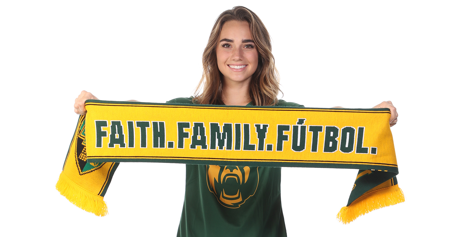 Baylor soccer player Kylie Ross holding a "Faith, Family, Futbol" scarf