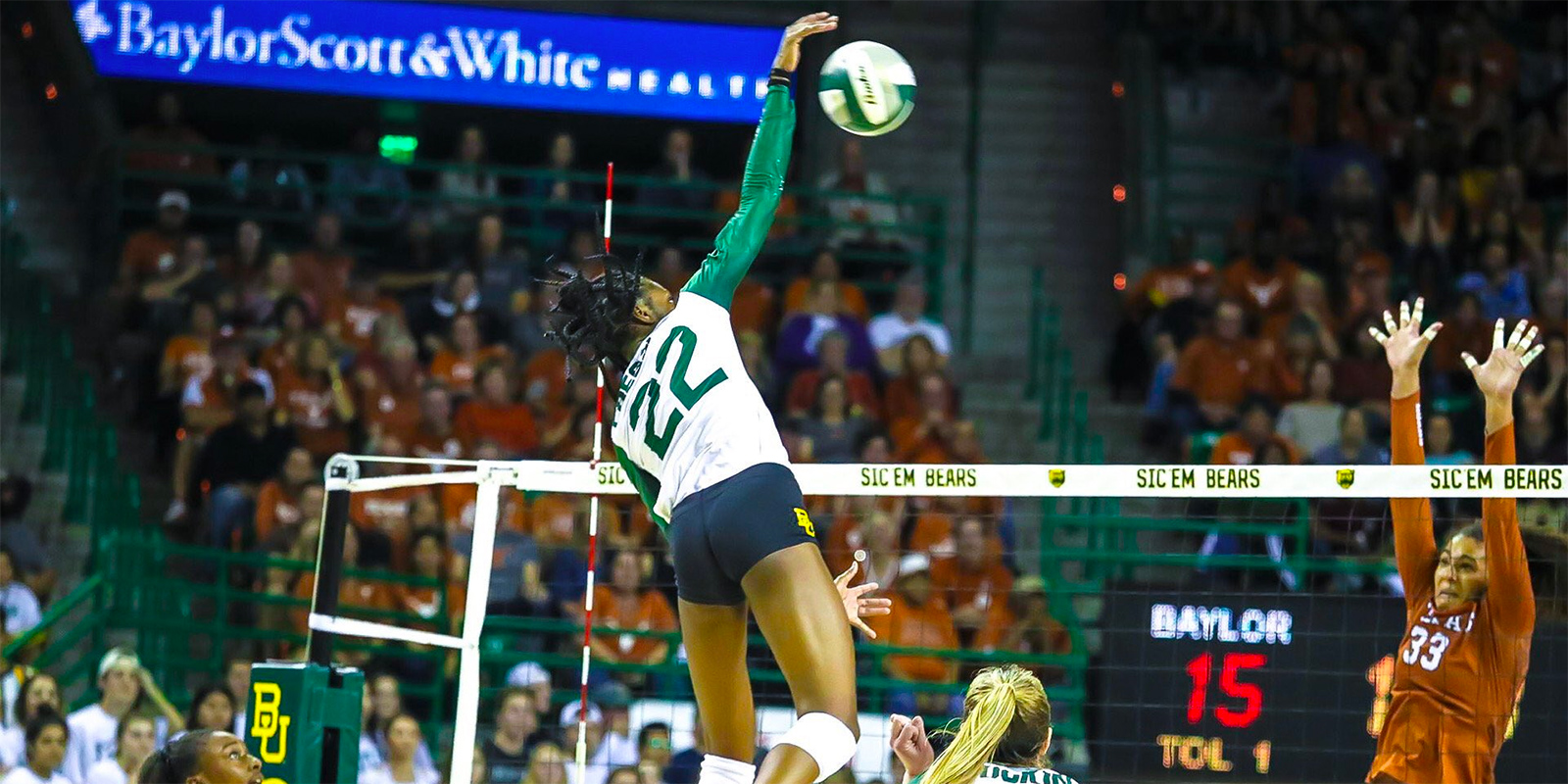 Baylor volleyball's Yossiana Pressley goes for the kill against Texas