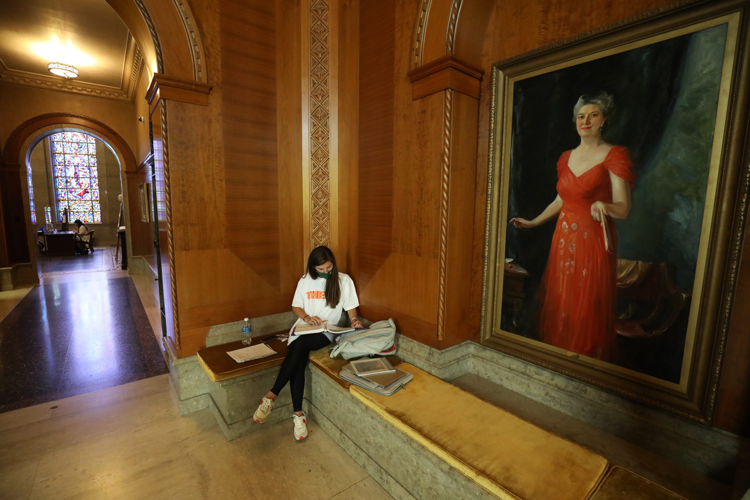 A student studying inside Armstrong Browning Library