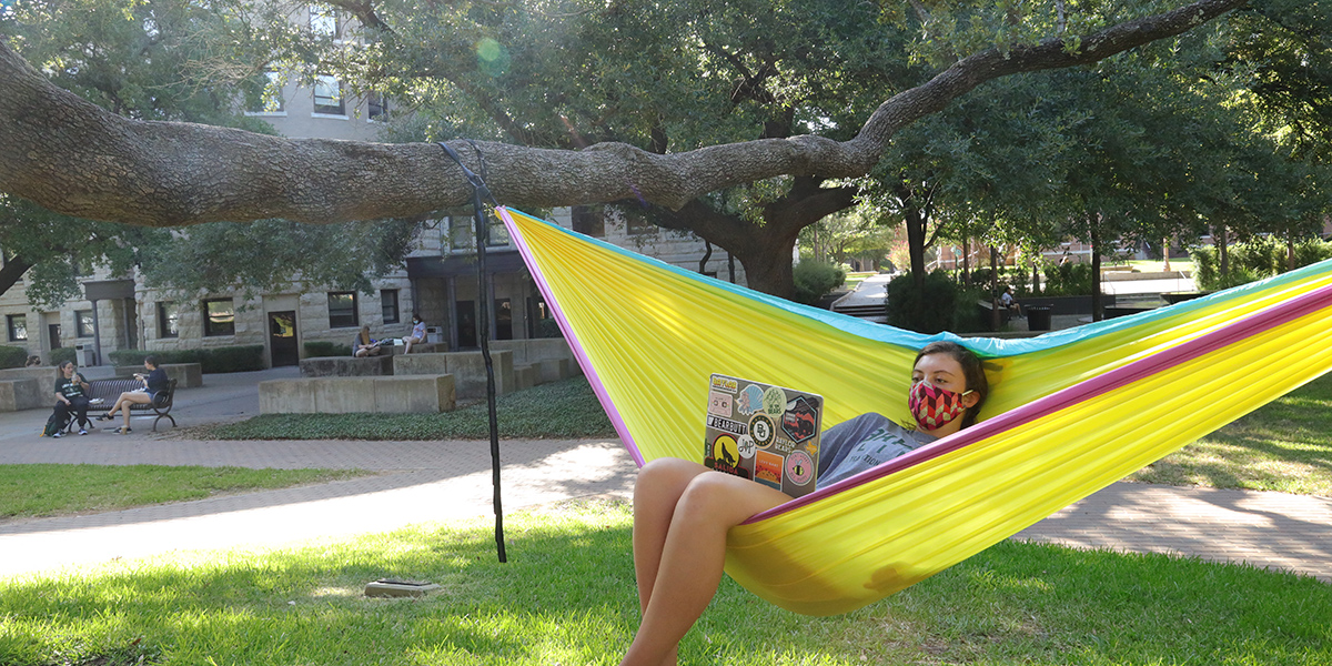 A Baylor student in a hammock outside Carroll Science Hall