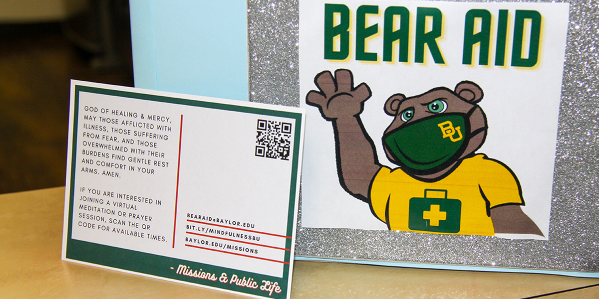 Photo of Bear Aid box and a prayer letter postcard