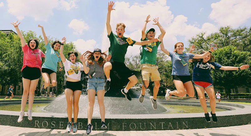Line Camp participants jumping by Rosenbalm Fountain