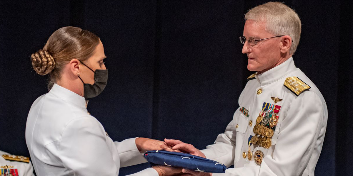 Vice Admiral John G. Hannink receiving an honorary flag