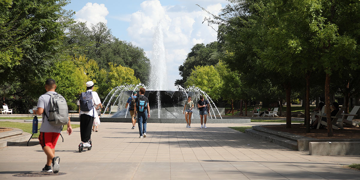 Students walking near Rosenbalm Fountain