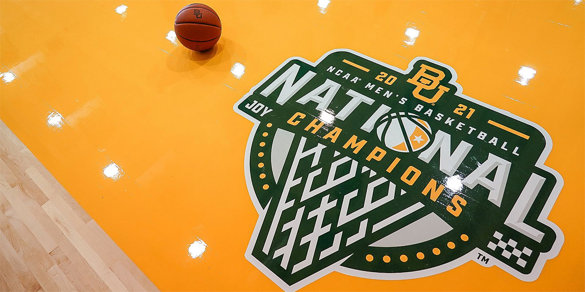Men's basketball national champions logo on practice court floor
