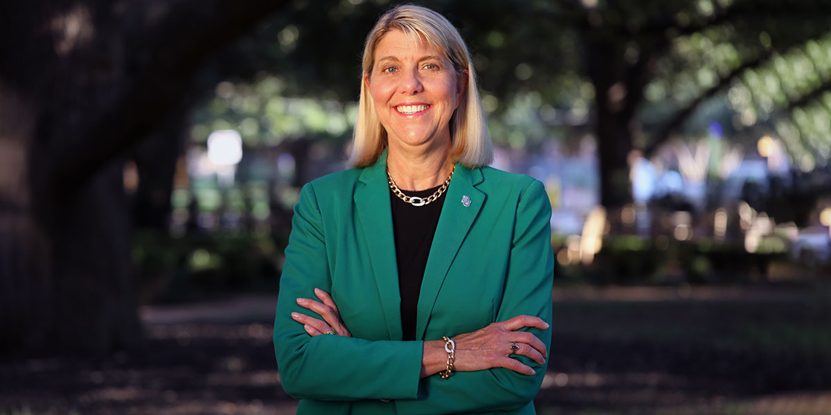 President Linda Livingstone standing on campus