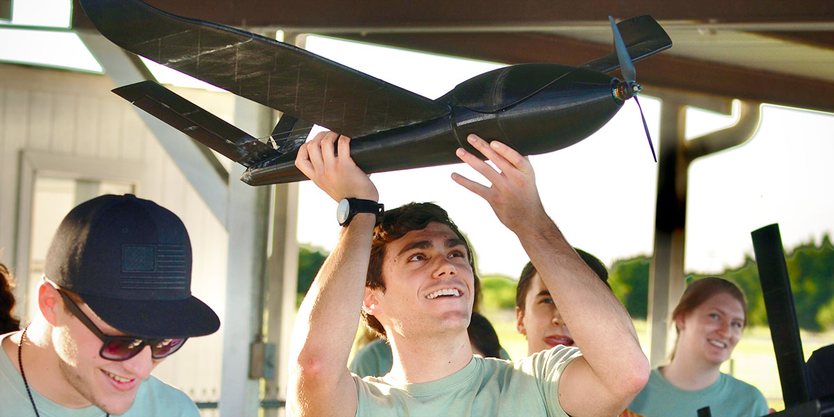 A Baylor student holds an Aero creation