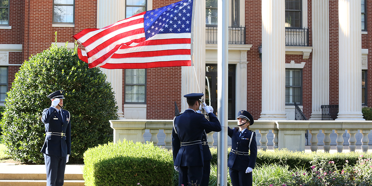 Baylor ROTC students salute the U.S. flag