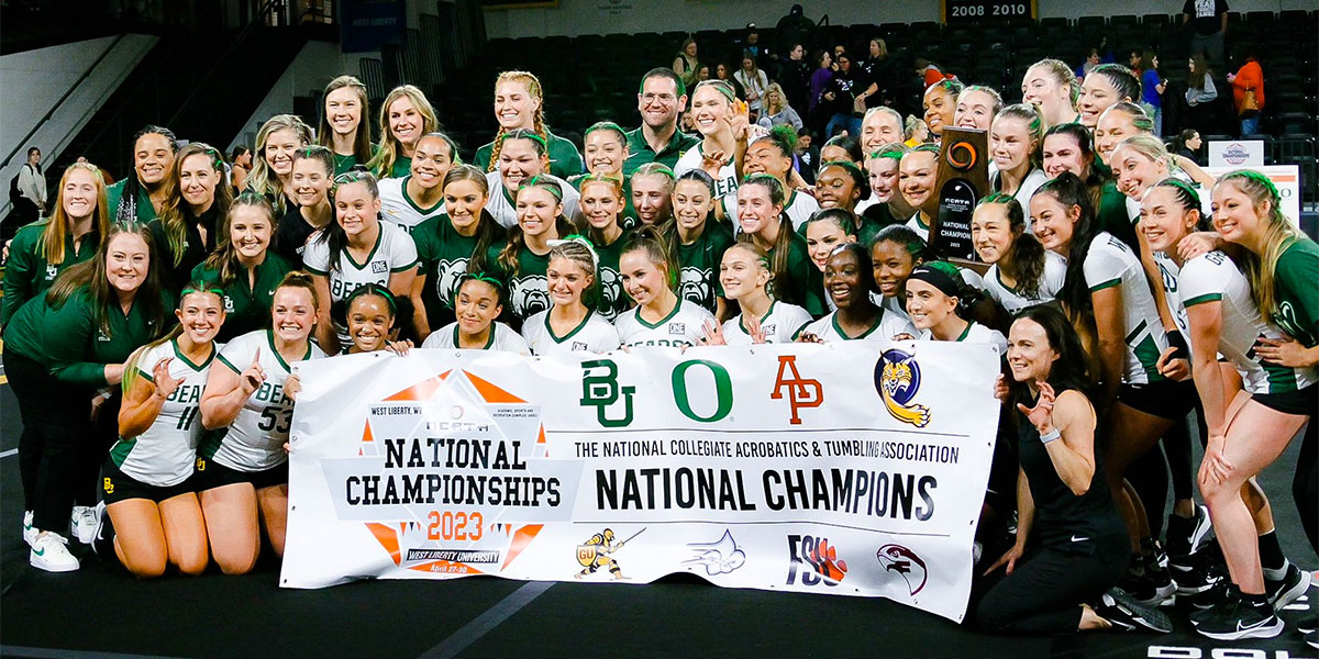 Baylor Acrobatics & Tumbling posing with their trophy