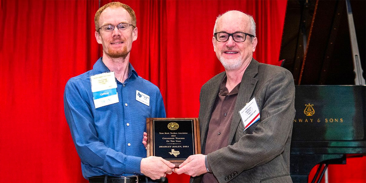 Dr. Bradley Bolen (right) receives his honor from the Texas Music Teachers Association