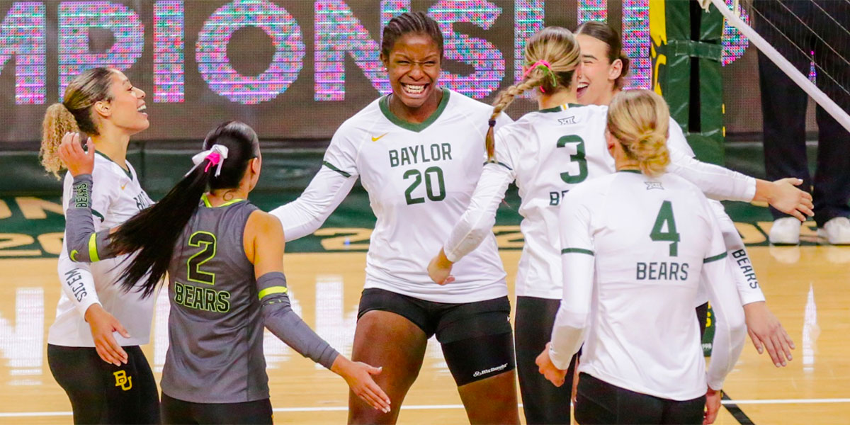 Baylor volleyball players celebrating a point on the court