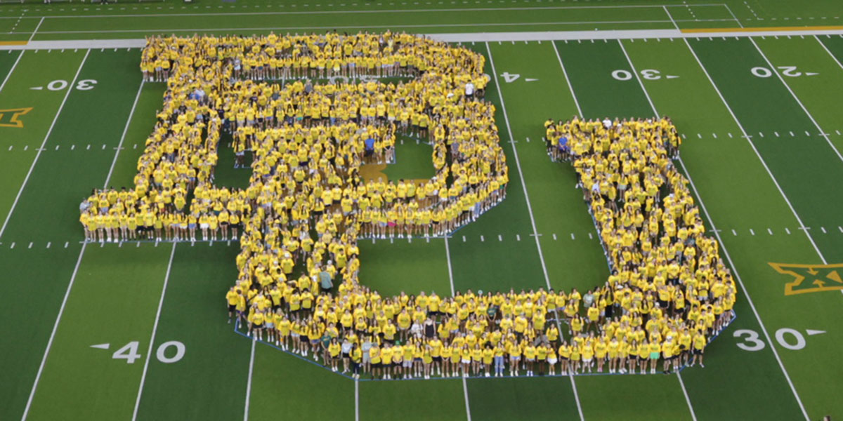 Baylor's Class of 2027 class photo, forming a "BU" at McLane Stadium