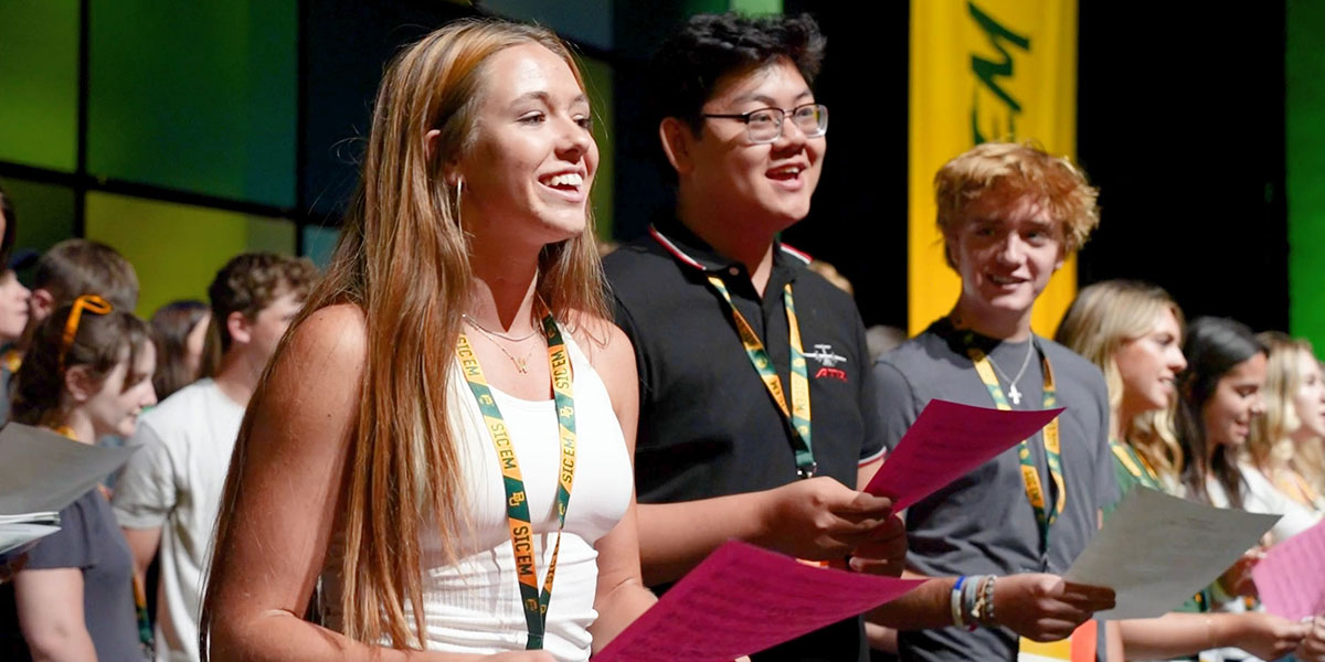 Baylor students singing on stage