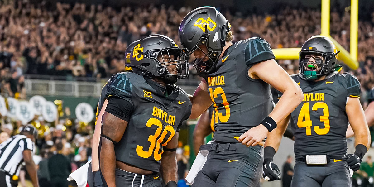 Sawyer Robertson and Bryson Washington celebrate a touchdown