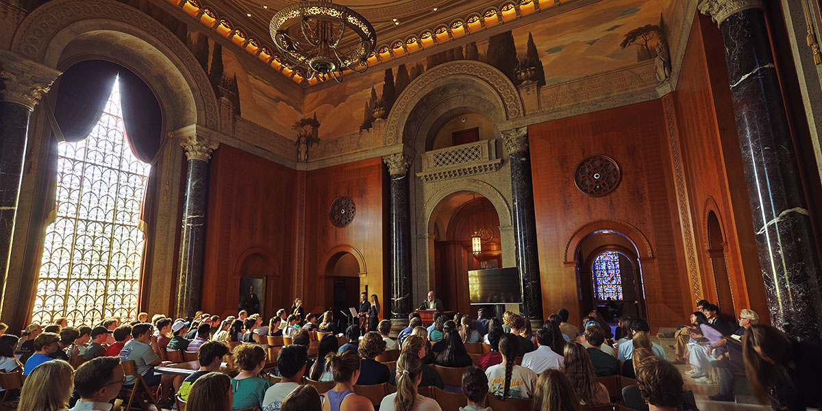 An academic gathering in Armstrong Browning Library's beautiful McLean Foyer of Meditation